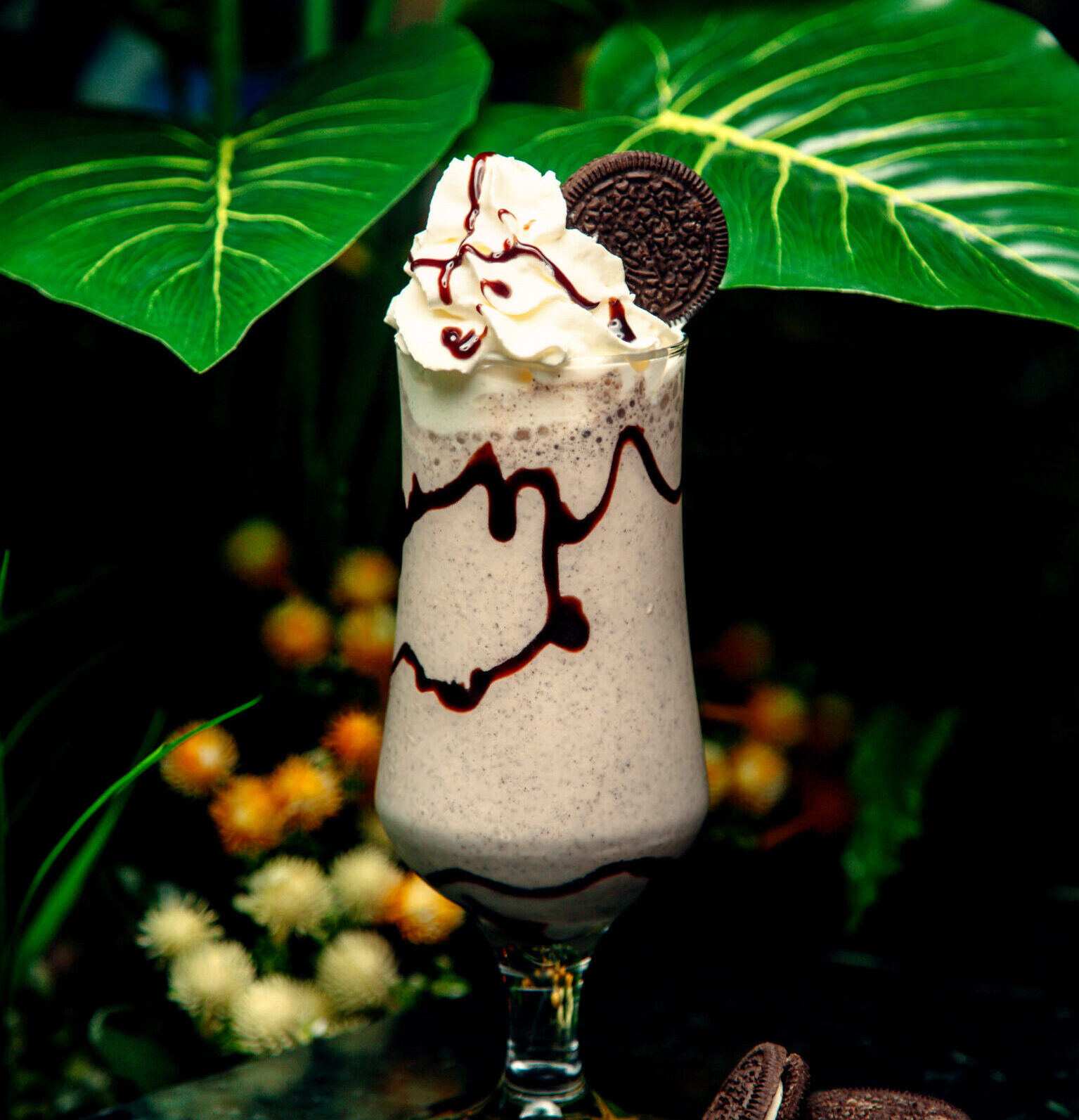 milkshake with whipped cream and oreo cookie on top